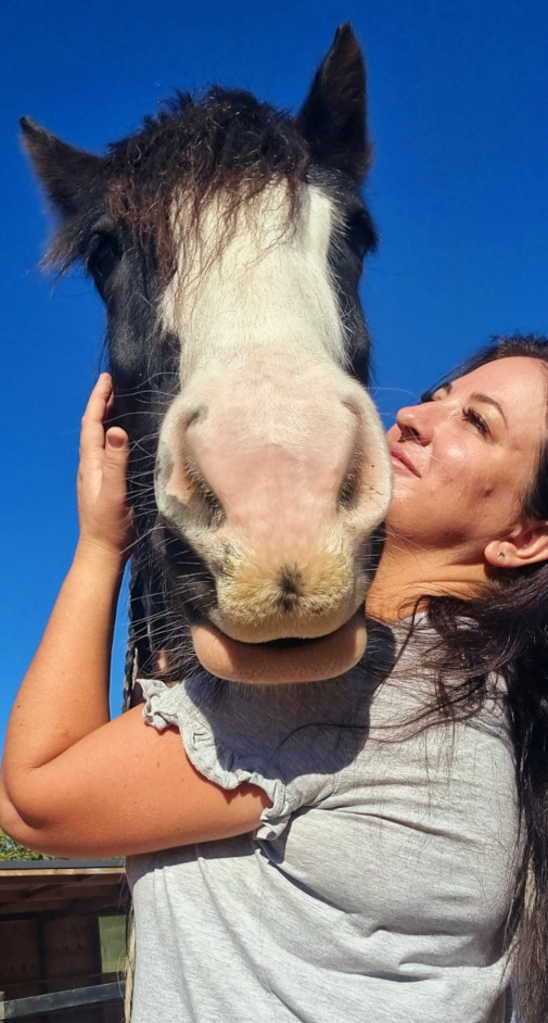 Therapist hugging horse